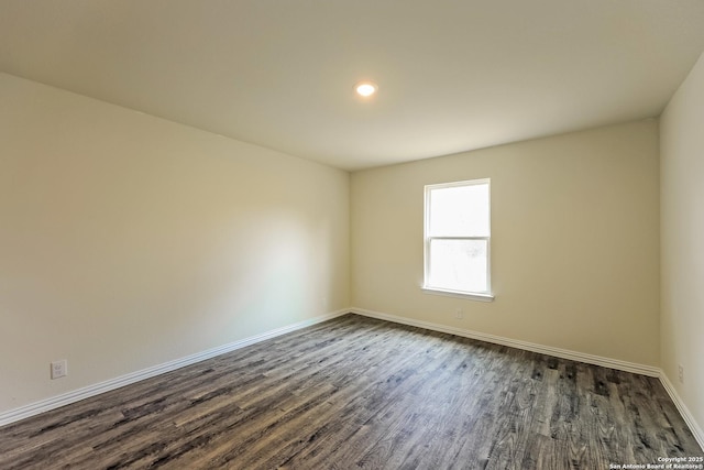2430 Bermuda, San Antonio, TX 78222 - empty room with dark wood-type flooring, recessed lighting, and baseboards