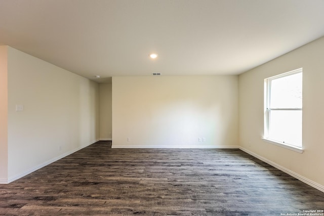 2430 Bermuda, San Antonio, TX 78222 - unfurnished room featuring recessed lighting, baseboards, dark wood finished floors, and visible vents