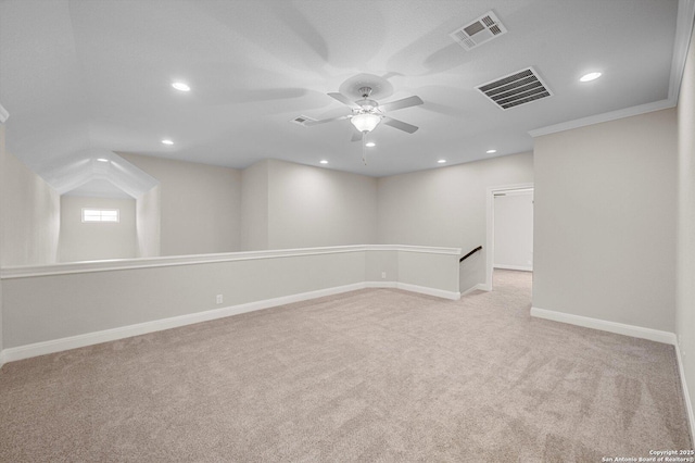 basement with light colored carpet, visible vents, and recessed lighting