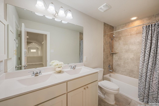bathroom featuring visible vents, a sink, tile patterned flooring, and toilet