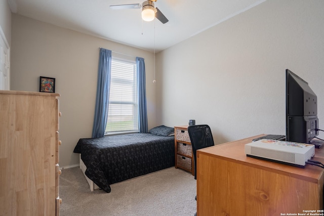 bedroom featuring ceiling fan and light carpet