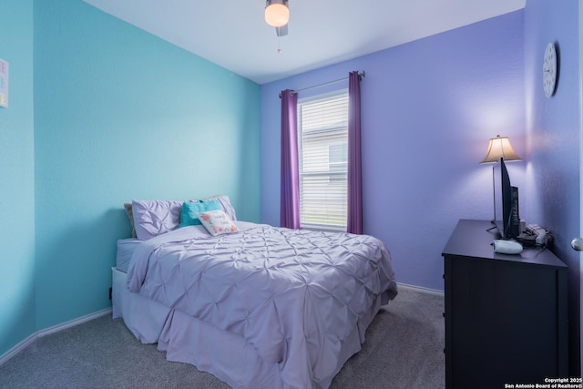 bedroom featuring carpet floors, baseboards, and ceiling fan