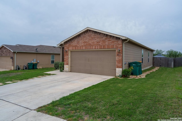 ranch-style home with fence, an attached garage, driveway, and a front lawn