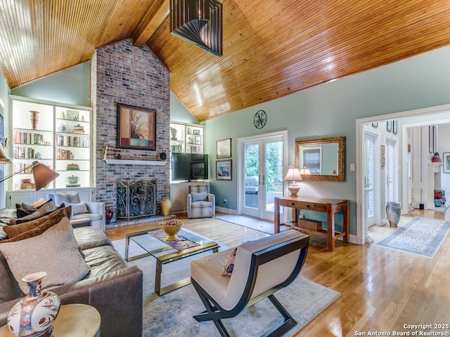 living room with wood ceiling, wood finished floors, and high vaulted ceiling