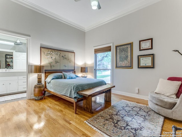 bedroom with light wood-style floors, ornamental molding, baseboards, and ceiling fan