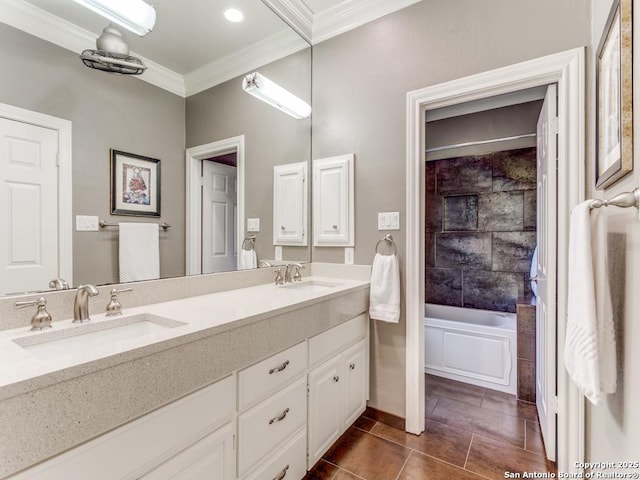 full bath featuring crown molding, double vanity, a sink, and tile patterned flooring