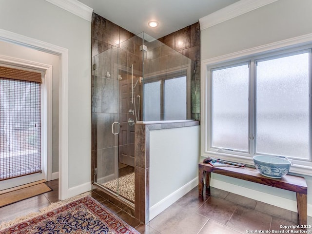 bathroom featuring tile patterned flooring, recessed lighting, baseboards, a shower stall, and ornamental molding