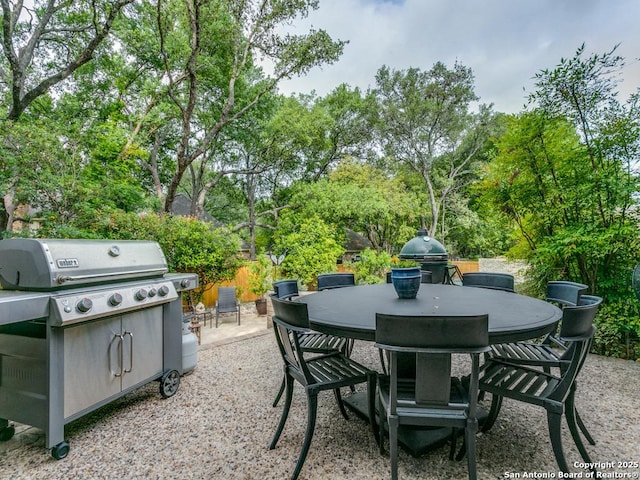 view of patio featuring outdoor dining space and a grill