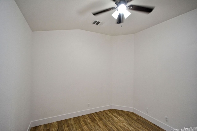 empty room with a ceiling fan, baseboards, visible vents, and wood finished floors