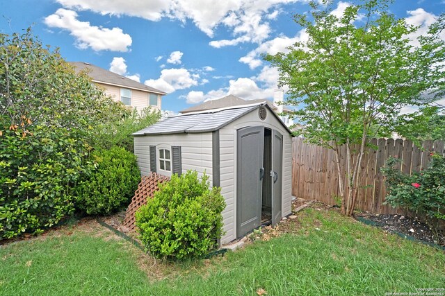 view of shed with fence