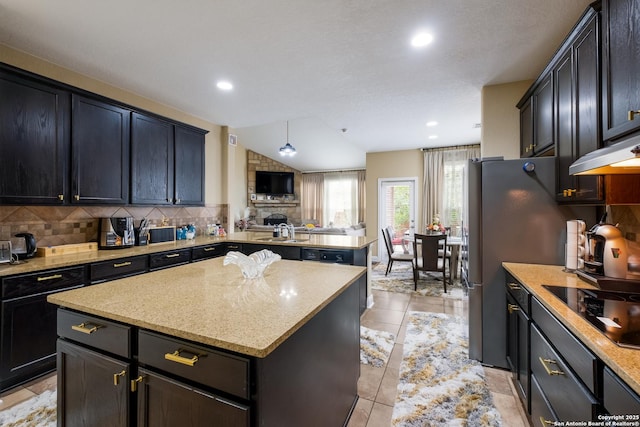 12422 Caprock Crk, San Antonio, TX 78254 - kitchen featuring decorative backsplash, a kitchen island, a sink, a peninsula, and black electric stovetop