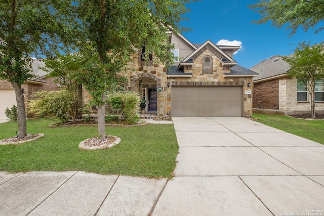 12422 Caprock Crk, San Antonio, TX 78254 - view of front of home with concrete driveway, a front yard, and stone siding