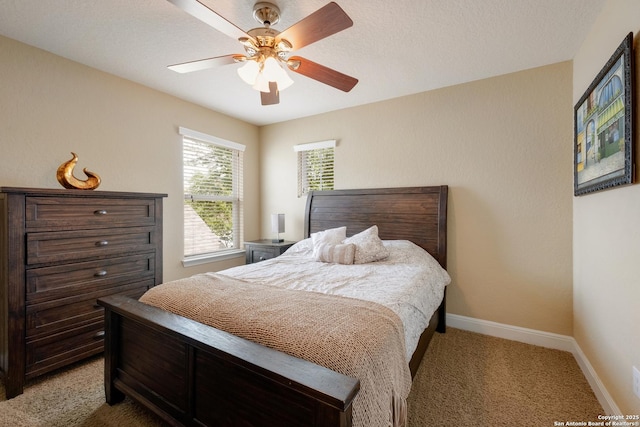 12422 Caprock Crk, San Antonio, TX 78254 - bedroom with baseboards, a ceiling fan, and light colored carpet