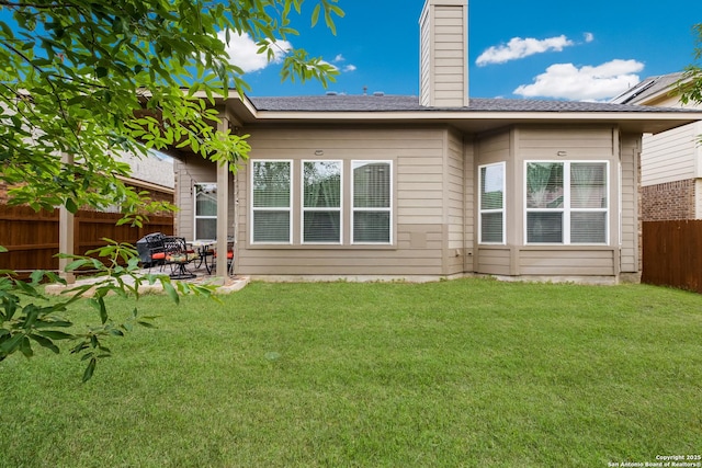 12422 Caprock Crk, San Antonio, TX 78254 - rear view of property featuring a yard, a patio, fence, and a chimney