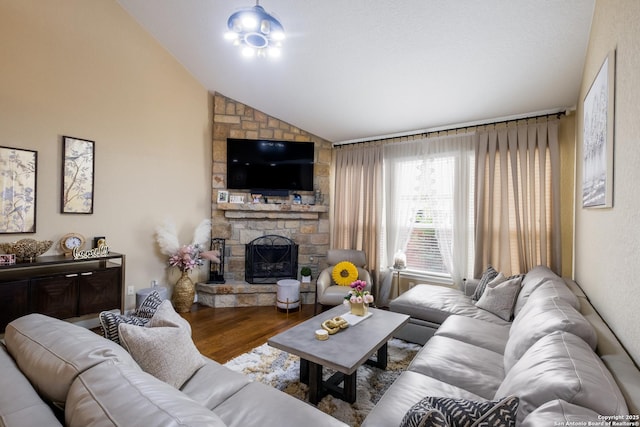 12422 Caprock Crk, San Antonio, TX 78254 - living room with lofted ceiling, wood finished floors, and a fireplace
