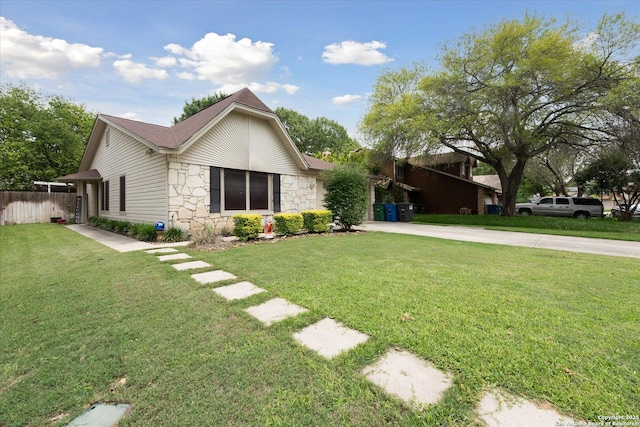 6927 Country Rose, San Antonio, TX 78240 - exterior space featuring fence, driveway, a front lawn, and stone siding