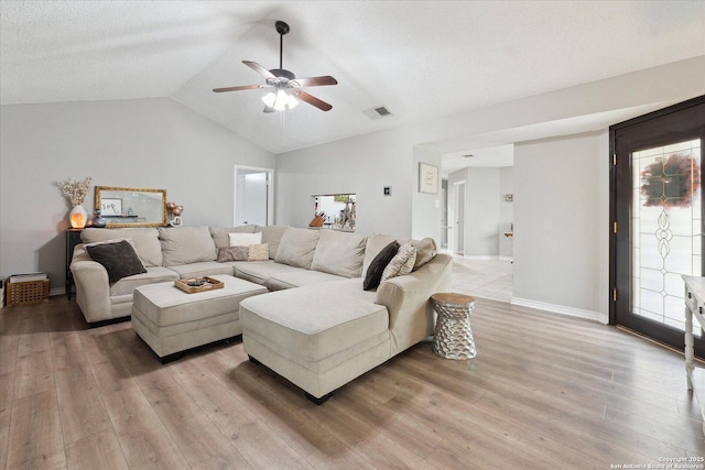 6927 Country Rose, San Antonio, TX 78240 - living area featuring a ceiling fan, visible vents, light wood-type flooring, baseboards, and lofted ceiling