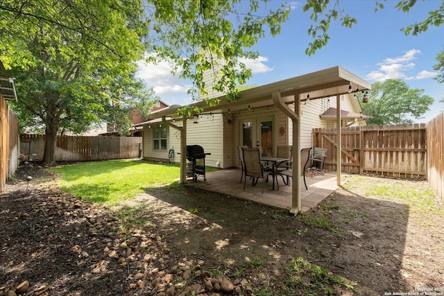 6927 Country Rose, San Antonio, TX 78240 - view of yard featuring a patio, a fenced backyard, and french doors