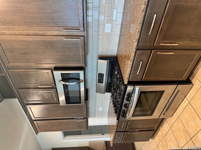 kitchen featuring dark brown cabinetry