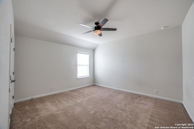 2241 Windswept, New Braunfels, TX 78132 - empty room featuring carpet floors, a ceiling fan, baseboards, and vaulted ceiling