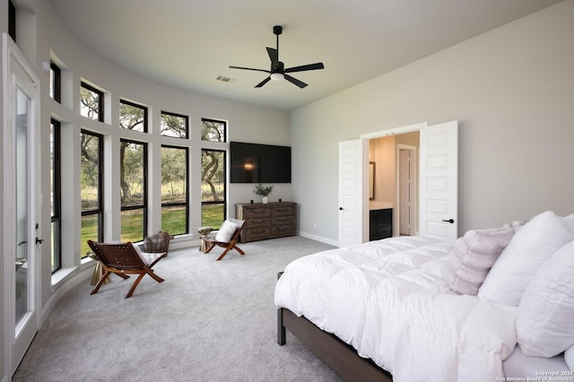bedroom with ceiling fan, visible vents, baseboards, connected bathroom, and carpet