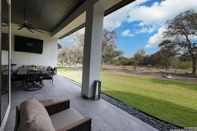 view of patio / terrace with ceiling fan and outdoor dining space