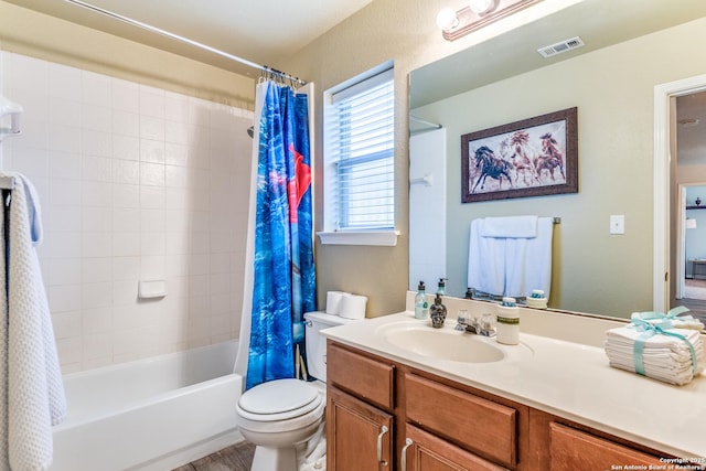 full bathroom featuring visible vents, shower / tub combo with curtain, toilet, and vanity