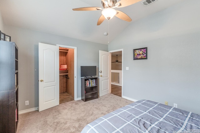 unfurnished bedroom featuring visible vents, baseboards, carpet floors, and vaulted ceiling
