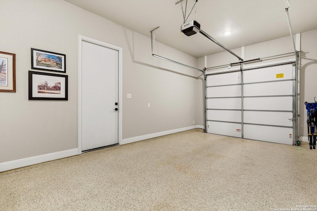 garage with baseboards and a garage door opener