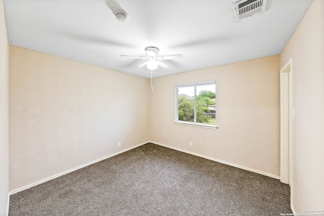 unfurnished room featuring ceiling fan, visible vents, baseboards, and carpet