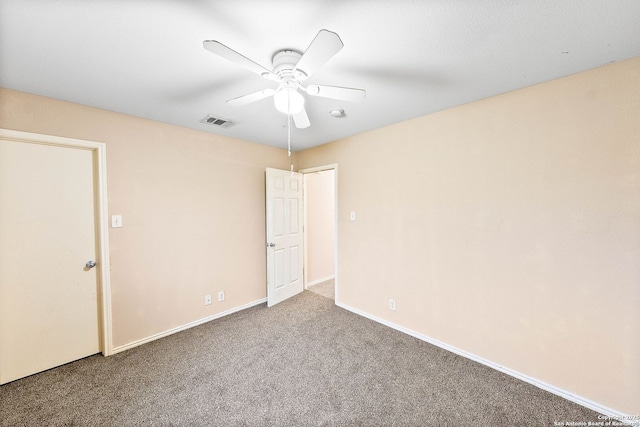 unfurnished bedroom featuring visible vents, carpet flooring, baseboards, and a ceiling fan