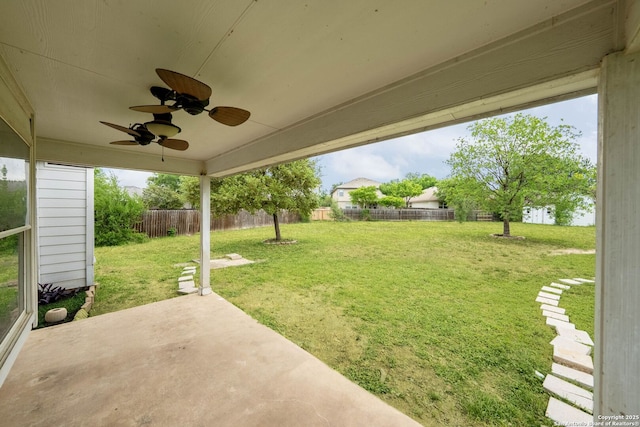 view of yard with a patio, a ceiling fan, and a fenced backyard