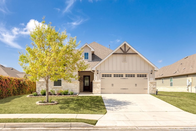 craftsman inspired home with board and batten siding, an attached garage, a front lawn, and stone siding