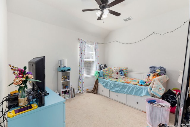 carpeted bedroom with visible vents, baseboards, ceiling fan, and lofted ceiling
