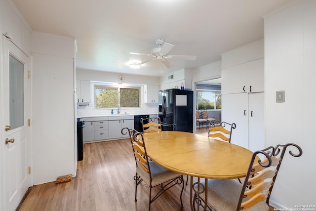 239 Sharon Dr, San Antonio, TX 78216 - dining area with ceiling fan, light wood finished floors, and visible vents