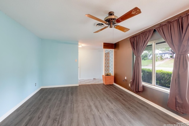 239 Sharon Dr, San Antonio, TX 78216 - empty room with baseboards, ceiling fan, and wood finished floors