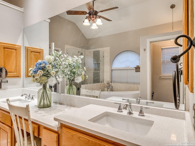 full bath featuring double vanity, a ceiling fan, a shower stall, a tub to relax in, and a sink