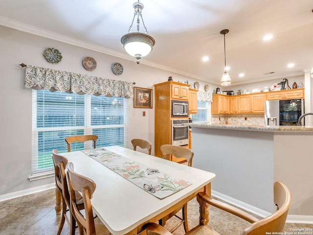 dining space with baseboards, ornamental molding, and recessed lighting