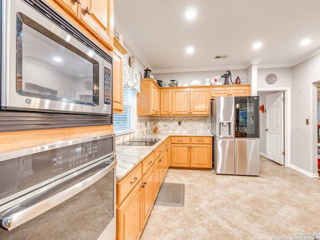 kitchen with visible vents, crown molding, tasteful backsplash, light brown cabinets, and stainless steel appliances
