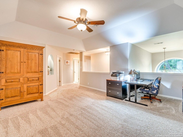 carpeted home office with ceiling fan, vaulted ceiling, and baseboards