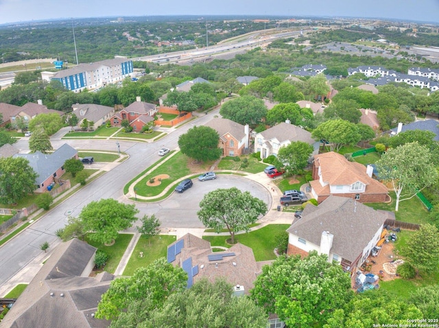 birds eye view of property with a residential view