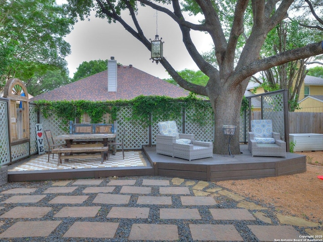 wooden deck featuring fence