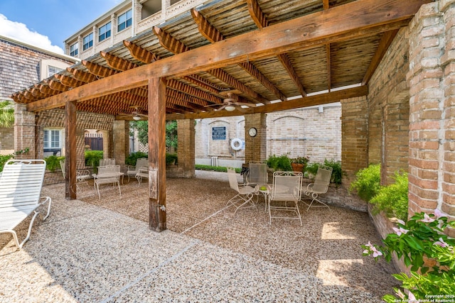 7731 Broadway Unit I-42, San Antonio, TX 78209 - view of patio with a ceiling fan and outdoor dining space