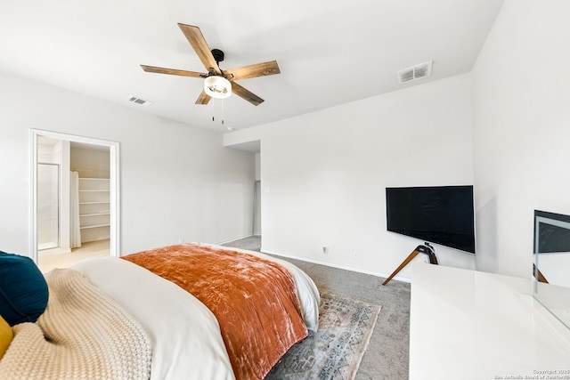 carpeted bedroom with baseboards, visible vents, and ceiling fan