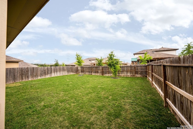view of yard with a fenced backyard