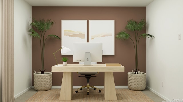carpeted office space featuring baseboards