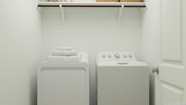 clothes washing area with laundry area and washer and clothes dryer