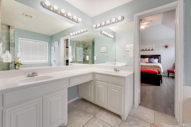 ensuite bathroom with a sink, ceiling fan, ensuite bathroom, and visible vents