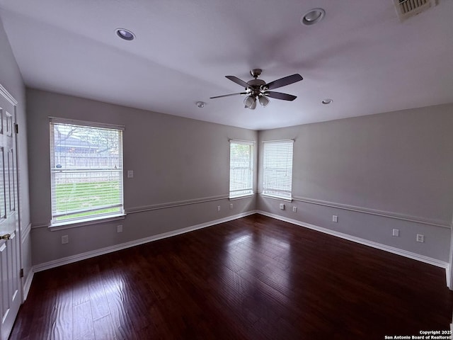unfurnished room featuring a ceiling fan, recessed lighting, wood finished floors, and visible vents