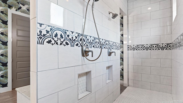 bathroom with walk in shower and wood finished floors